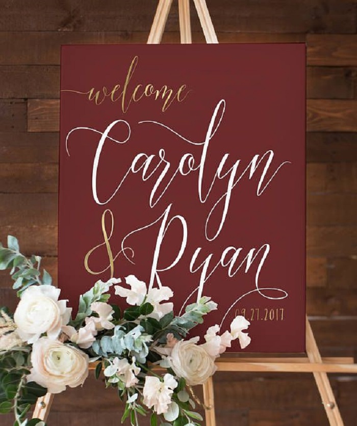 Burgundy sign boards with golden fonts