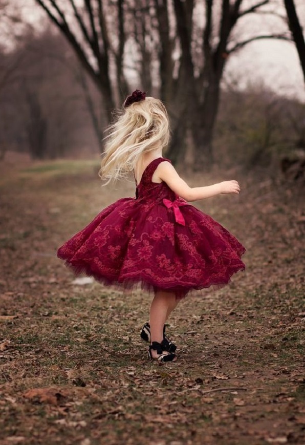 Flower girls in burgundy colored dress with golden tiara