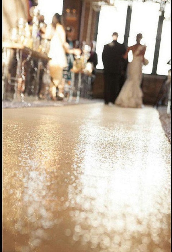 Burgundy aisle runner with golden glitter all over it