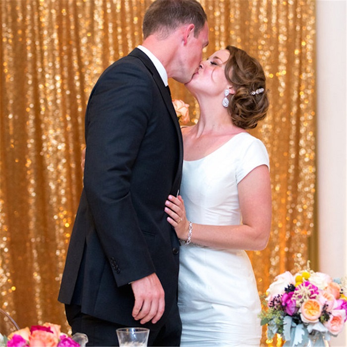 use Gold sequined fabric as backdrop and add colorful balloons