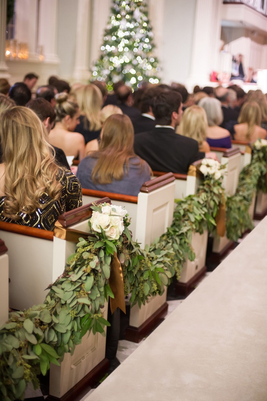 garland strategically draped and candles at Church - 123WeddingCards